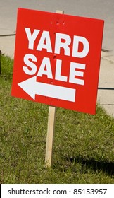 Yard sale sign on lawn
