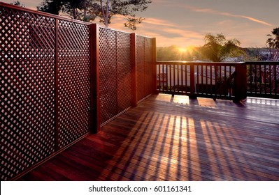 Yard With Wooden Floors And Wooden Fence With The Sunset View