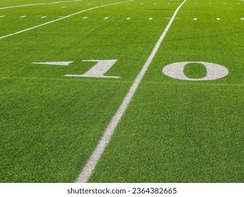 A yards sign of an American football field - Powered by Shutterstock