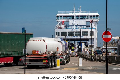 Yarmouth, Isle Of Wight, England, UK. 2021.  Commercial Truck And Oil Tanker Lorry Loading Onto A Ro Ro Ferry Bound For Lymington On The Mainland.