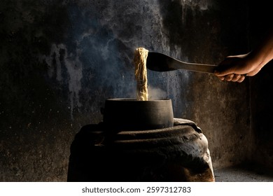 Yarn dyeing process by boiling method. The yarn is dyed with natural dye sources. The yellow dyed yarn is boiled in a hot kettle.