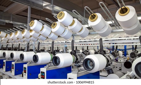 Yarn Spinning Machines.
Row Of Automated Machines For Yarn Manufacturing. Modern Textile Plant. Textile Manufacturing Of Synthetic Fibers.