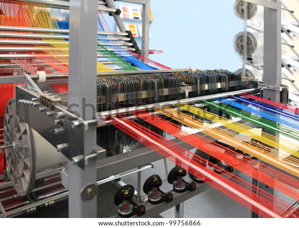 yarn warping\
machine in a textile weaving\
factory