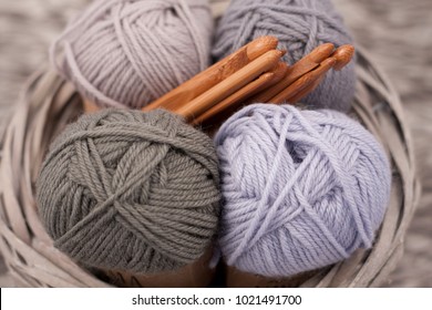 Yarns In Basket With Crochet Hooks In Harmonious Colors.
Knitting, Crocheting Supplies.