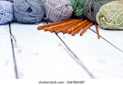 Yarns In Basket With Crochet Hooks In Harmonious Colors. Knitting, Crocheting Supplies.