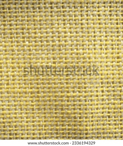 Yarns from small yellow threads that are woven and sewn into cloth beads