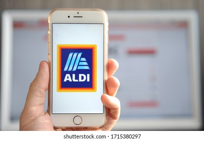Yaroslavl, Russia - 26 April 2020: Smartphone with logo of Aldi retail company and web site on background.