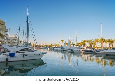 Yatchs in Marina port at dusk in Benalmadena, Malaga, Spain. - Shutterstock ID 596732117