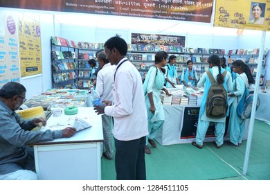 YAVATMAL, MAHARASHTRA, INDIA 12 JANUARY 2019 : Unidentified people visit bookstore for purchase in book exhibition during Marathi Literature conference, Yavatmal, India.