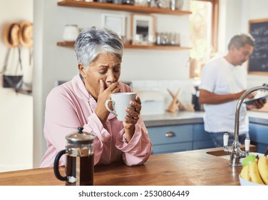 Yawn, morning and coffee with mature woman in kitchen for wake up, caffeine fix and energy. Fatigue, breakfast and tired with senior people drinking at home for retirement, peace and calm together - Powered by Shutterstock