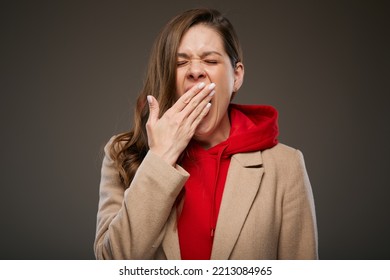 Yawning Bored Woman Isolated Portrait On Dark Brown.