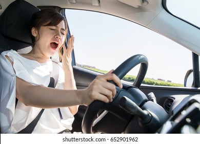 Yawning Female Driver. Falling Asleep At The Wheel Concept.