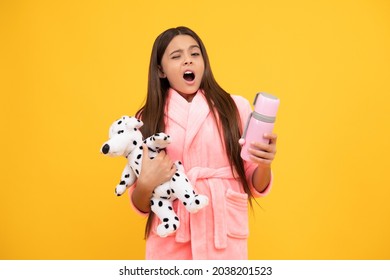 Yawning Teen Girl In Home Terry Bathrobe With Toy And Thermos Bottle, Yawn