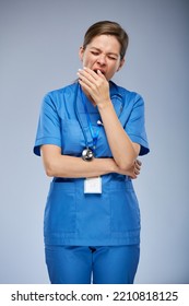 Yawning Tired Woman Nurse. Isolated Female Portrait.