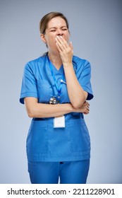 Yawning Tired Woman Nurse. Isolated Female Portrait.