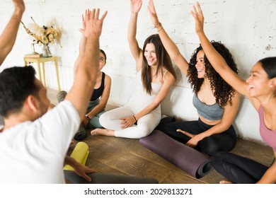 Yay! Happy Group Of Fitness People Smiling And Celebrating A Successful Class At The Yoga Studio