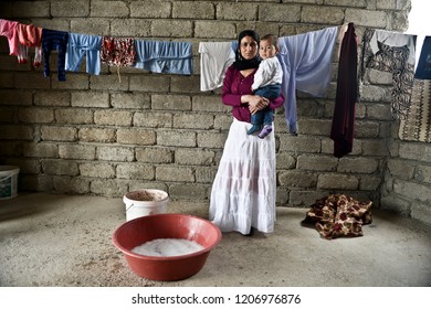 A Yazidi People Who Escaped Abuse From ISIS Outside Her Tent In Kanke Refugee Camp 17 MAY 2014. DOHUK, KURDISTAN, IRAQ -