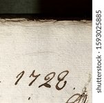 The year 1728 written in black ink on rag paper in an archival record from the following year