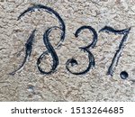 The year 1837 carved in stone and painted in black – taken from an inscription produced that year