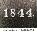 The year 1844 from a metal inscription – painted in black and white and produced at that time