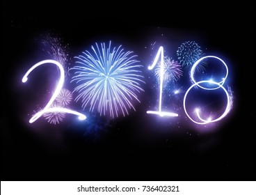 The year 2018 displayed with fireworks and strobes. New year and holidays concept.