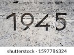 The year one thousand nine hundred and forty-five (1945) carved in stone. 