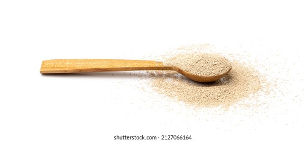 Yeast In Wooden Spoon Isolated. Dry Baking Yeast, Instant Barm Granules Pile, Bread Ingredients Side View