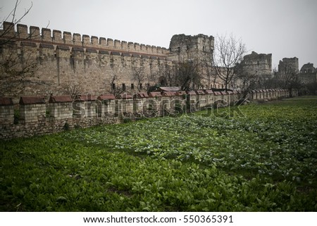 The Yedikule Fortress (Castle of Seven Towers) and ancient walls of Constantinople background in Istanbul, Turkey