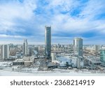 Yekaterinburg city with Buildings of Regional Government and Parliament, Dramatic Theatre, Iset Tower, Yeltsin Center, panoramic view at winter sunset. Translate: Yeltsin Center. Yekaterinburg, Russia