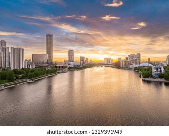 Yekaterinburg city with Buildings of Regional Government and Parliament, Dramatic Theatre, Iset Tower, Yeltsin Center, panoramic view at summer sunset. Yekaterinburg, Russia