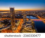 Yekaterinburg city and pond aerial panoramic view at summer or early autumn night. Night city in the early autumn. Buildings of Iset Tower, Yeltsin Center. Yekaterinburg, Russia. Aerial view.