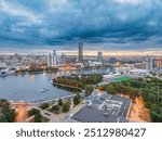 Yekaterinburg city and pond aerial panoramic view at summer or early autumn sunset. Night city in the early autumn. Yekaterinburg, Russia. Aerial view.