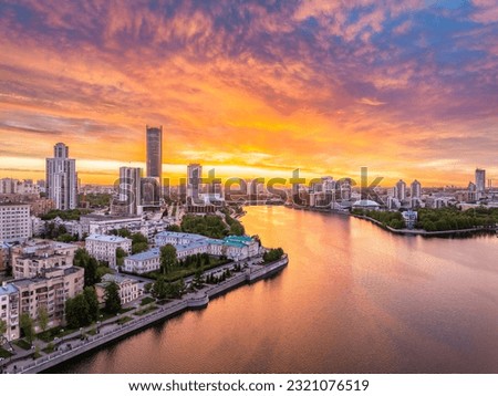 Yekaterinburg city and pond aerial panoramic view at summer sunset. Yekaterinburg, Russia