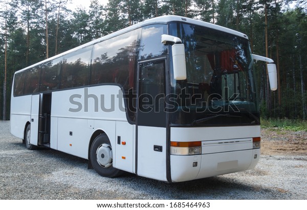 Yekaterinburg, Sverdlovsk region \
Russia-30.07.2016. white tourist bus close up standing in the\
Parking lot waiting for\
passengers