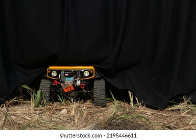 The Yellow 1:10 Scale RC Adventure Is Parked Under The Table To Avoid The Hot Sun (Gresik, 28 August 2022)