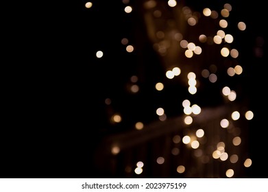 Yellow abstract bokeh made from Christmas lights on black isolated background. Holiday concept, blur bokeh, overlay for your images. - Shutterstock ID 2023975199