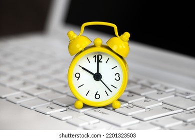 Yellow Alarm Clock On A White Laptop, Daylight Savings Time Background
