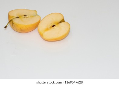 yellow apple slice on a white background - Shutterstock ID 1169547628