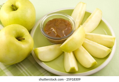 Yellow Apple Slices And Caramel Apple Dip With Copy Space