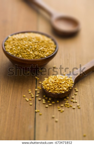 yellow arhar dal or\
raw pulse or toor dal