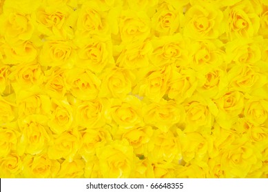 Yellow artificial rose background