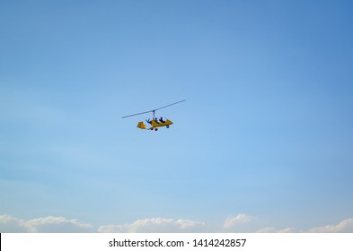yellow autogyro flying above dead sea in jordan