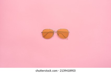 Yellow Aviator Sunglasses (aviators) On A Pastel Pink Background. Copy Space, Flat Lay. 