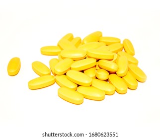 yellow b vitamin pills isolated on white background