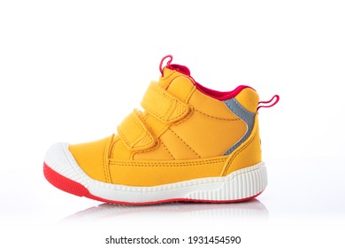 Yellow Baby Shoes. Kids Sport Sneakers Isolated On White Background