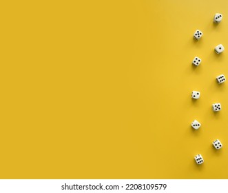 Yellow Background With White-Black Scattered Dice. Simple Minimalist Layout with Border made of Dices. No Text. Symbol of Gambling or Big Luck. Game Cubes.