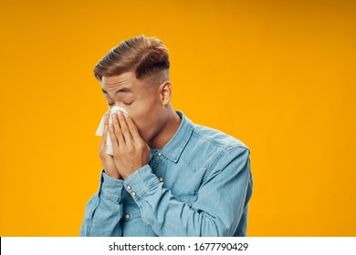 Yellow Background Young Man Runny Nose Blue Shirt