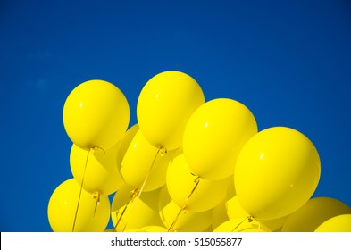 Yellow Balloons At The Blue Sky Background