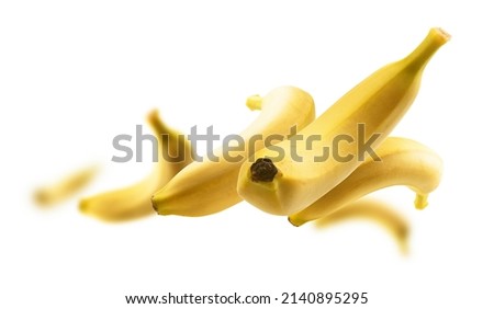 Yellow bananas levitate on a white background