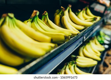 yellow bananas on store shelf. fruits grocery shopping